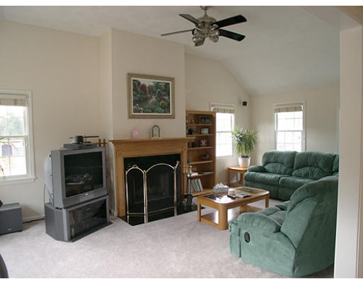 104 South Road Pepperell, MA 01463 - Photo 4 of 7 a living room with furniture a window and a fireplace