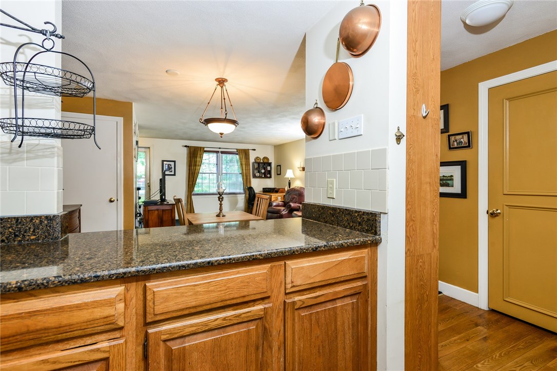 1175 Diamond Hill Road, Unit 105 Woonsocket, RI 02895 - Photo 11 of 28 Kitchen view to living room over island