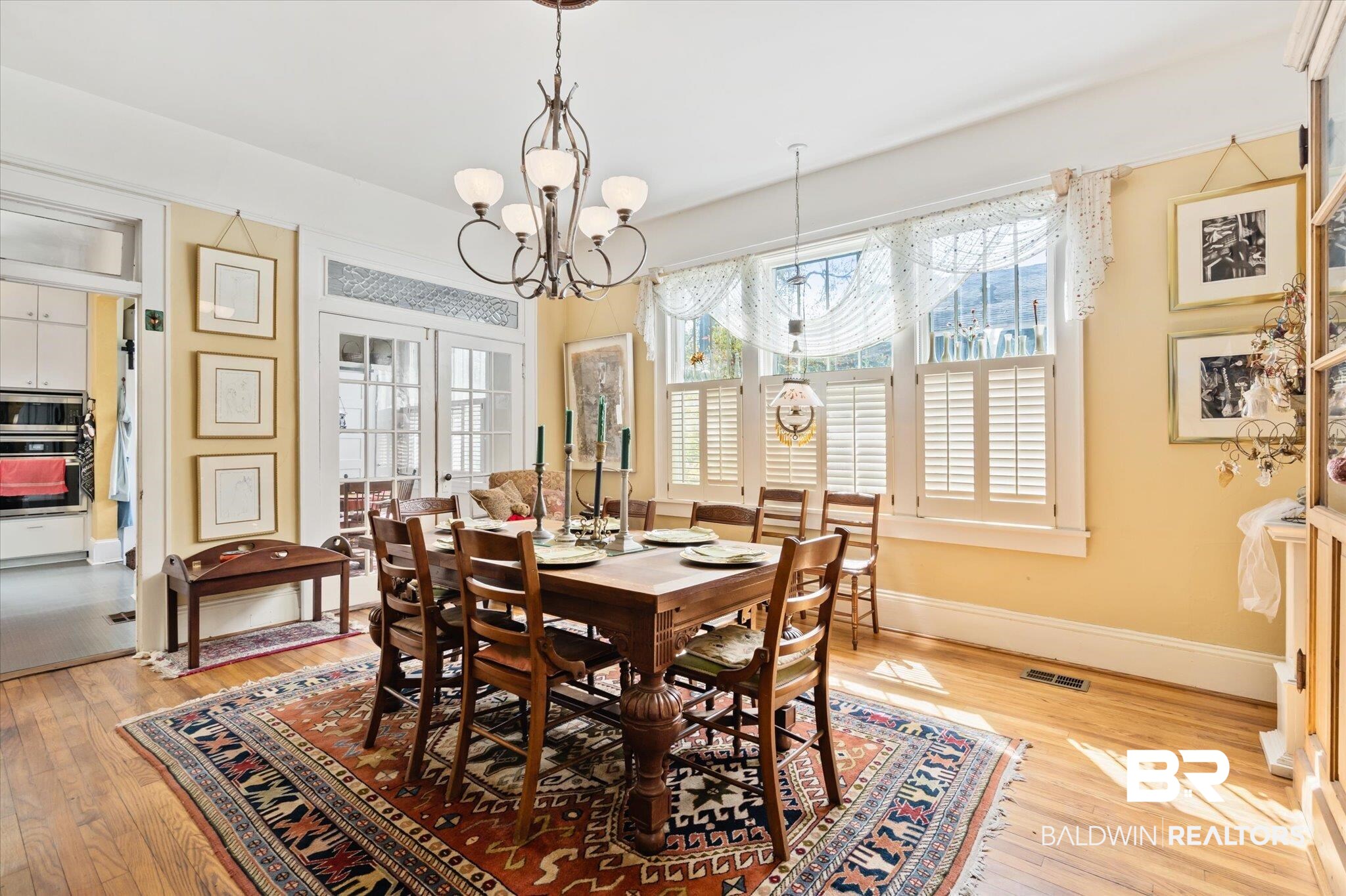 12 Lebaron Street Mobile, AL 36602 - Photo 6 of 37 Dining space with a notable chandelier and light hardwood / wood-style floors