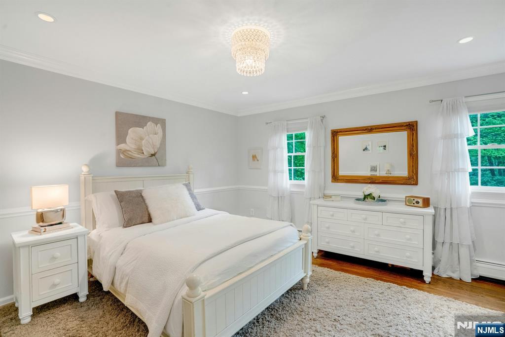 48 Hopper Farm Road Upper Saddle River, NJ 07458 - Photo 19 of 43 a bedroom with a bed and a window