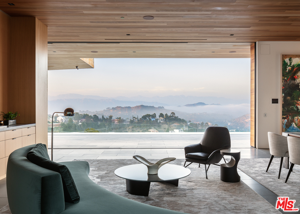 1966 Carla Ridge Beverly Hills, CA 90210 - Photo 1 of 1 a living room with furniture and a window