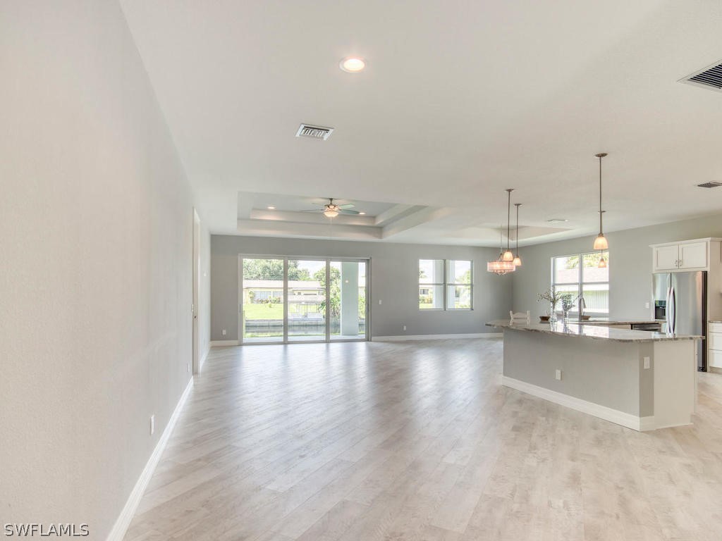 12523 River Road Fort Myers, FL 33905 - Photo 11 of 24 a view of an empty room with kitchen and window