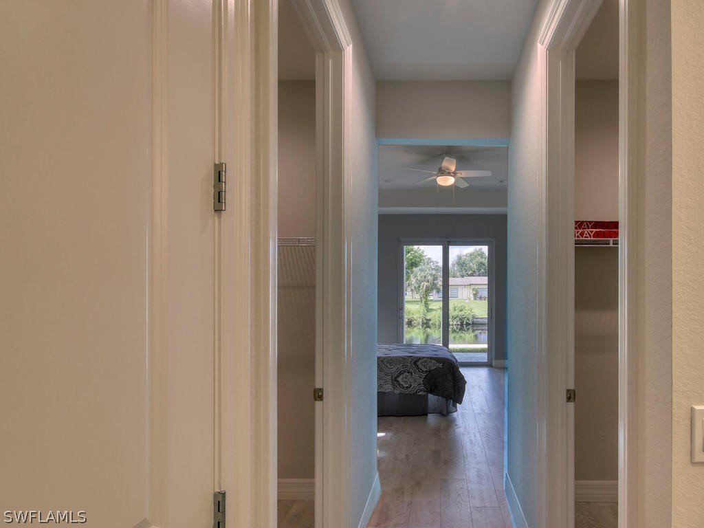 12523 River Road Fort Myers, FL 33905 - Photo 16 of 24 a view of a hallway with a large window and wooden floor