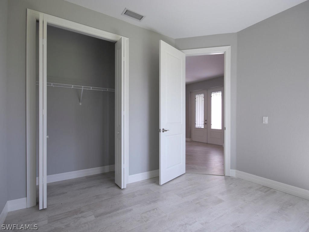 12523 River Road Fort Myers, FL 33905 - Photo 18 of 24 an empty room with closet and a bathroom