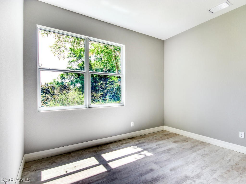 12523 River Road Fort Myers, FL 33905 - Photo 19 of 24 an empty room with a window