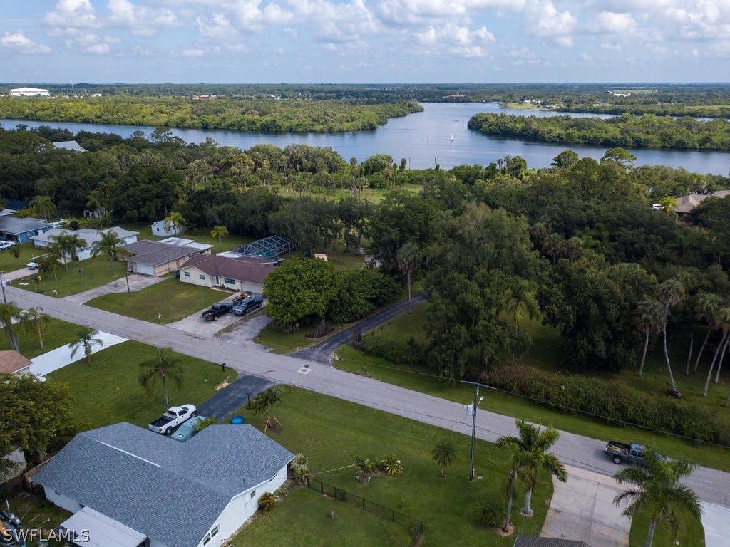 12523 River Road Fort Myers, FL 33905 - Photo 22 of 24 an aerial view of residential houses with outdoor space and lake view