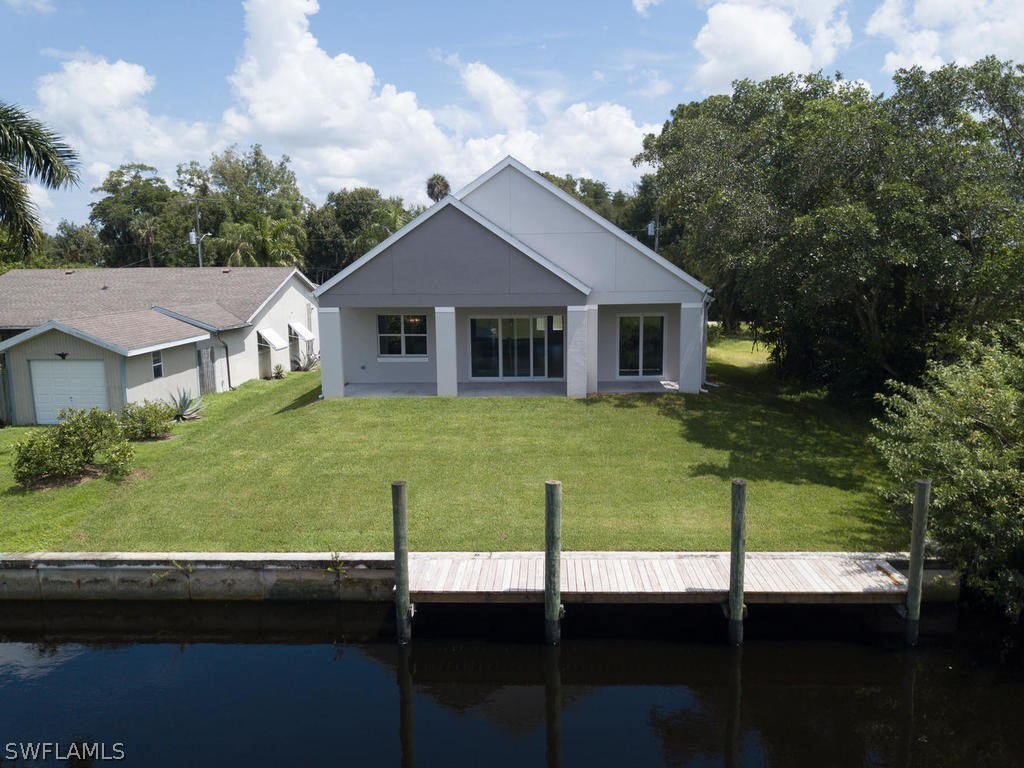 12523 River Road Fort Myers, FL 33905 - Photo 23 of 24 a view of a house with a backyard