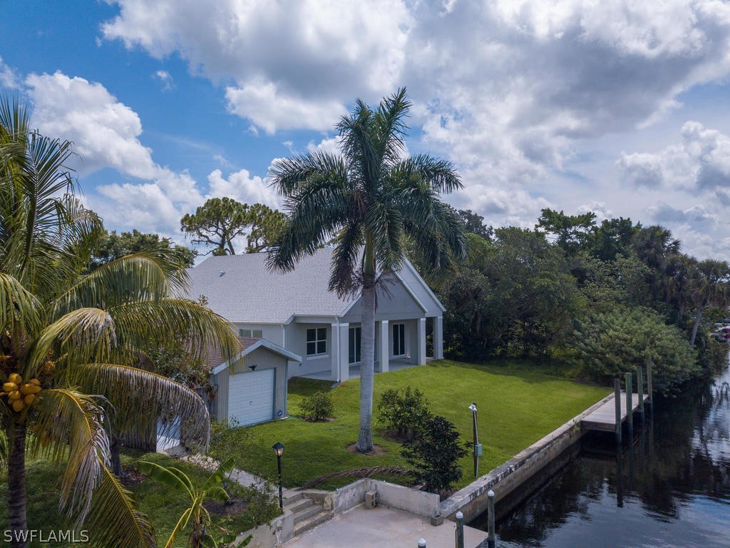 12523 River Road Fort Myers, FL 33905 - Photo 24 of 24 a front view of a house with garden
