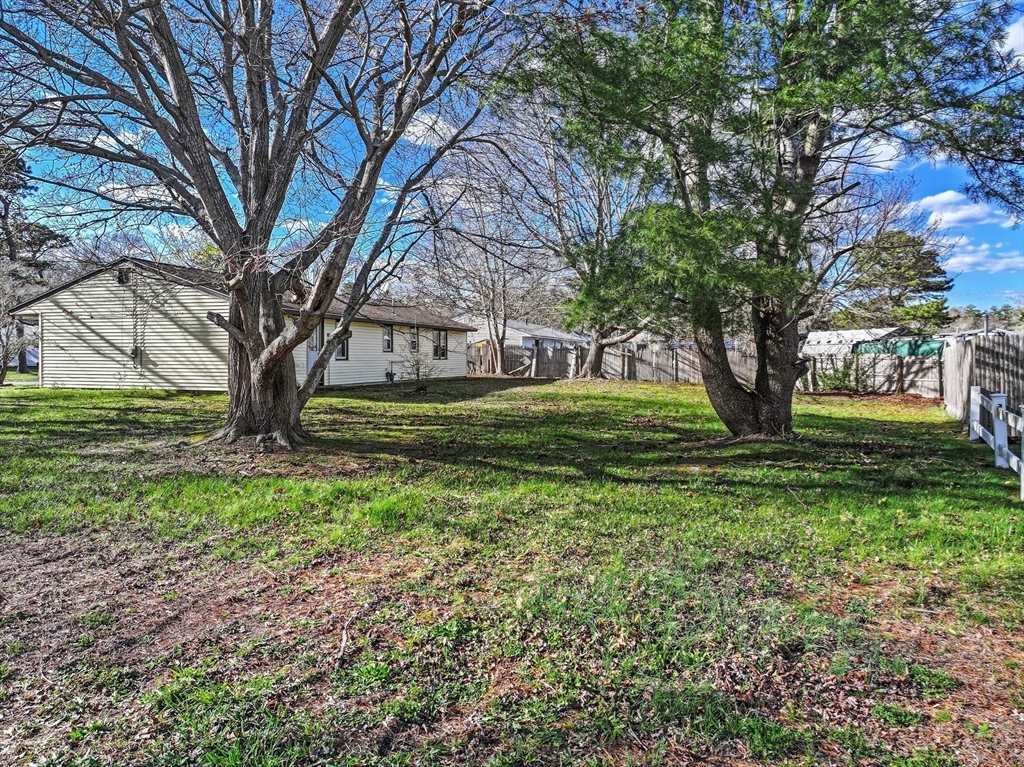 12 Parker Drive Wareham, MA 02571 - Photo 23 of 32 a view of a backyard with large trees