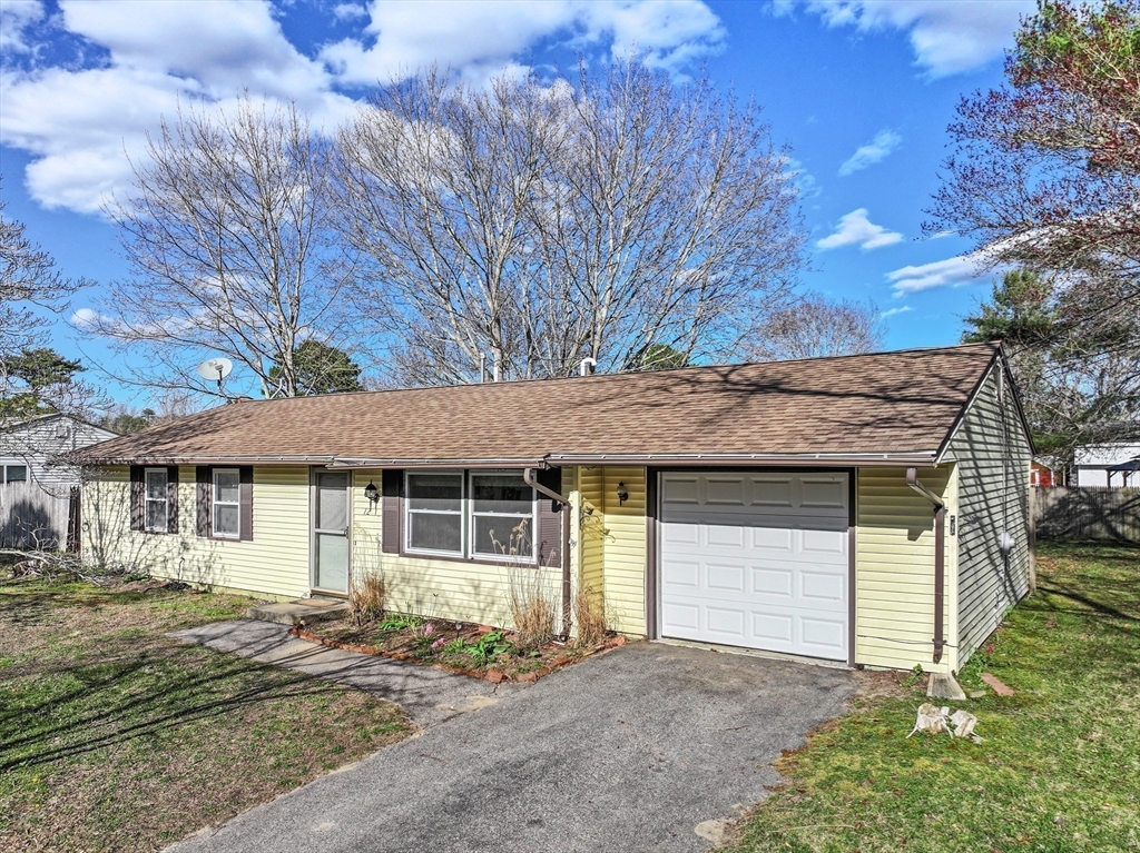 12 Parker Drive Wareham, MA 02571 - Photo 24 of 32 a front view of a house with a garden and yard