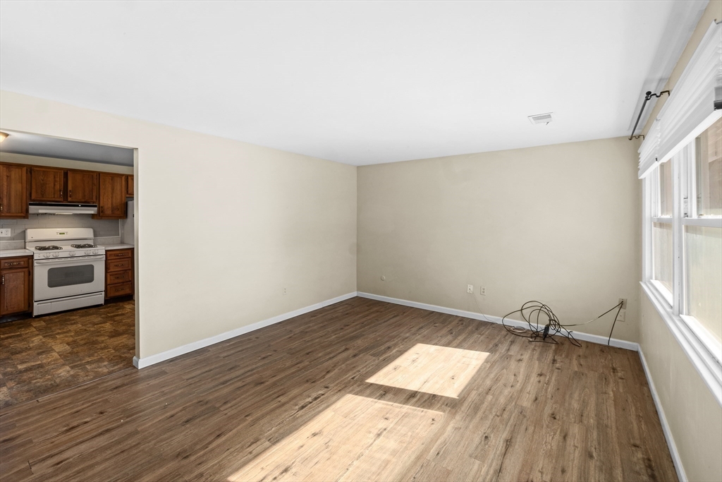 12 Parker Drive Wareham, MA 02571 - Photo 5 of 32 a view of a kitchen with wooden floor and a sink