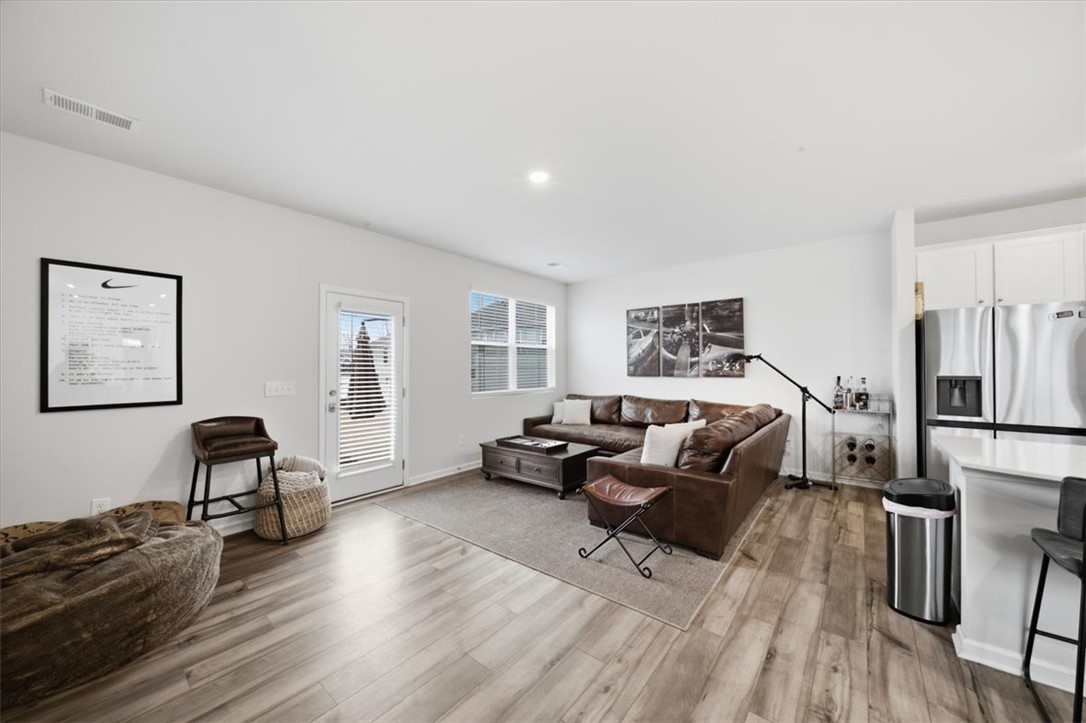 455 Bee Cv Way Pendleton, SC 29670 - Photo 13 of 46 This inviting space offers an open concept design with beautiful flooring and ample natural light.