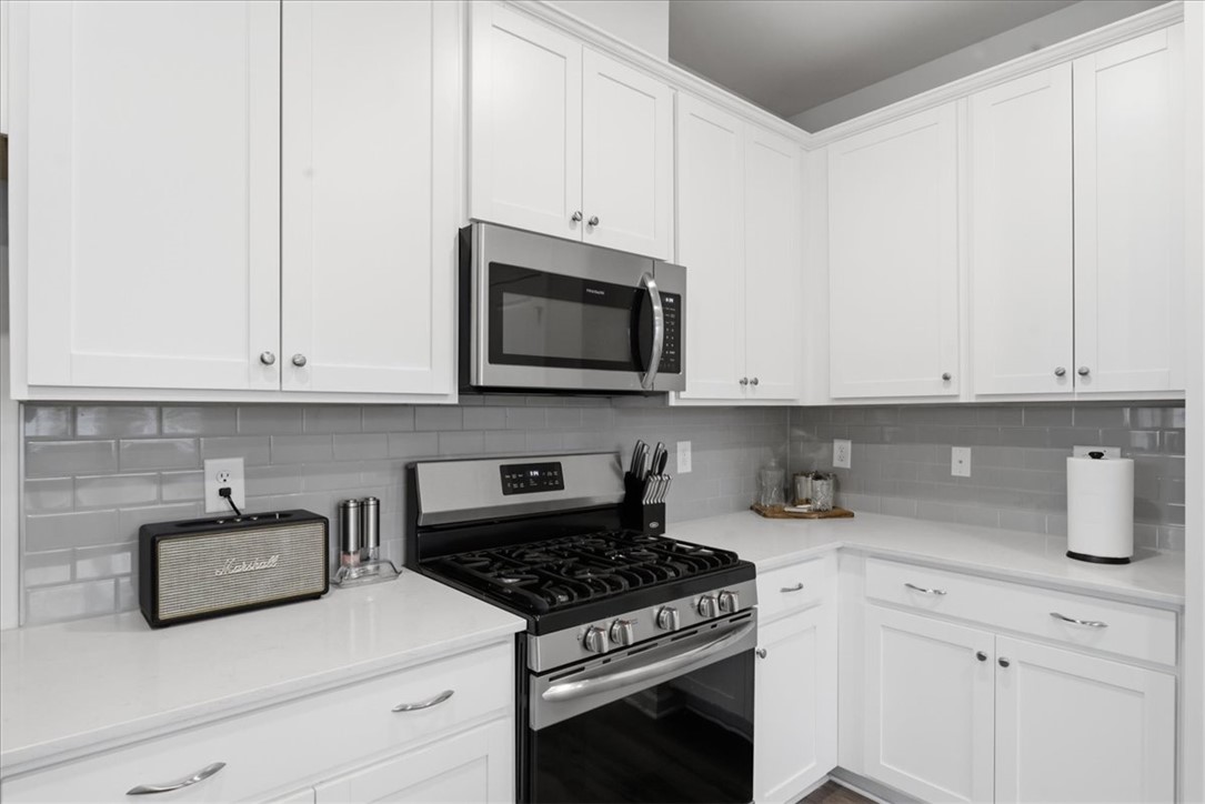 455 Bee Cv Way Pendleton, SC 29670 - Photo 13 of 46 This clean kitchen features bright cabinetry and essential appliances for daily living.