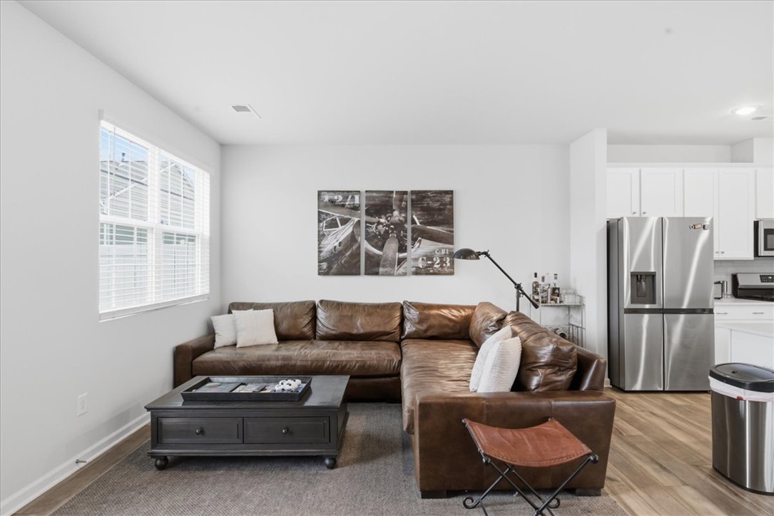 455 Bee Cv Way Pendleton, SC 29670 - Photo 14 of 46 This inviting living area seamlessly connects to the kitchen, creating an open and fluid living space.