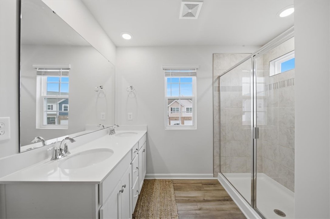 455 Bee Cv Way Pendleton, SC 29670 - Photo 24 of 46 This bathroom offers dual vanities and a spacious walk-in shower for ultimate comfort.