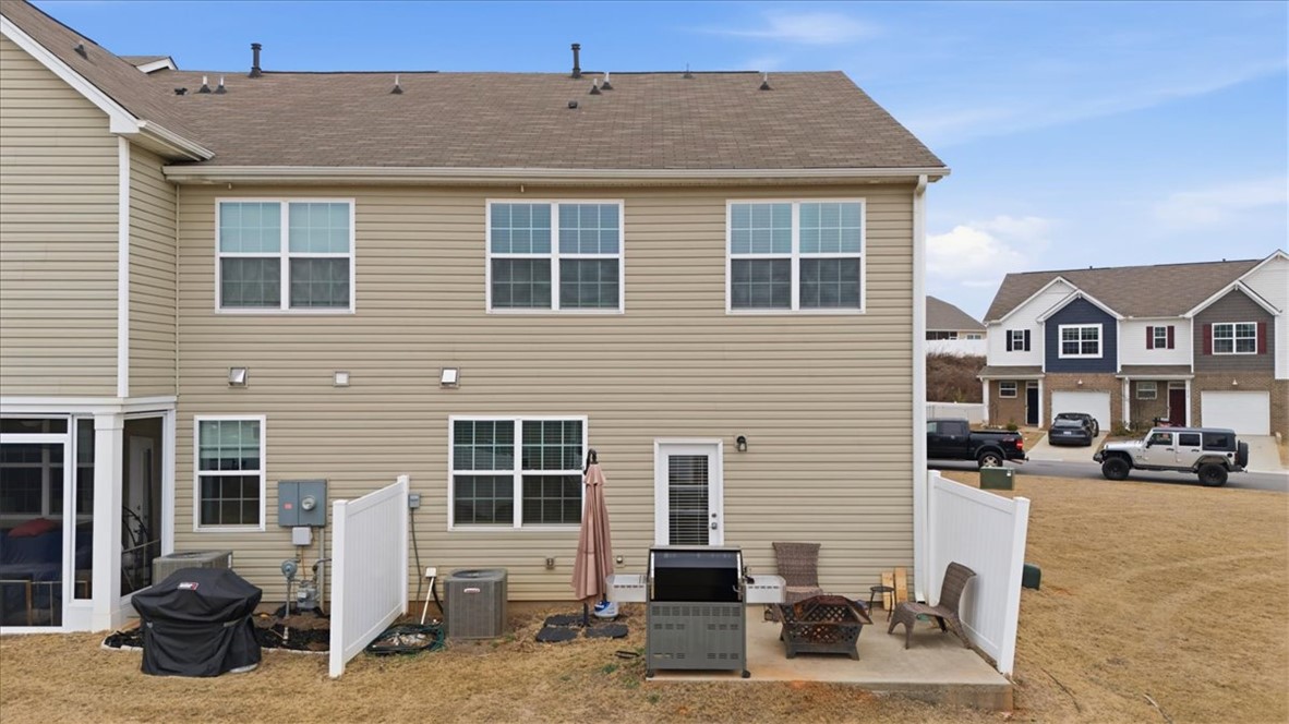 455 Bee Cv Way Pendleton, SC 29670 - Photo 29 of 46 This townhome features a well-maintained exterior and a private patio space, perfect for outdoor enjoyment.