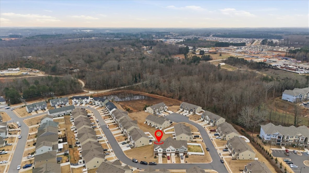 455 Bee Cv Way Pendleton, SC 29670 - Photo 39 of 46 This aerial perspective showcases a residential neighborhood nestled beside a serene pond.