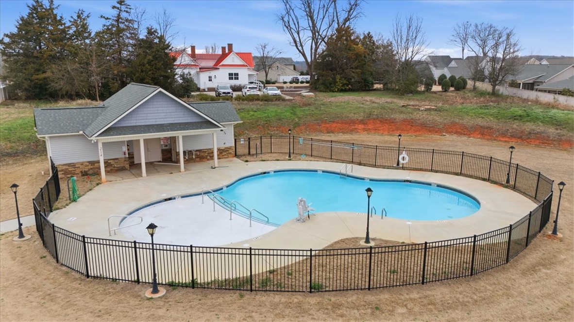 455 Bee Cv Way Pendleton, SC 29670 - Photo 39 of 46 This inviting outdoor pool area offers relaxation and recreation within a fenced setting.