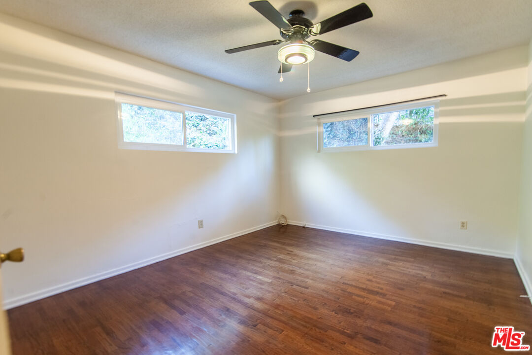 826 Hyperion Avenue Los Angeles, CA 90029 - Photo 11 of 25 a view of an empty room with wooden floor