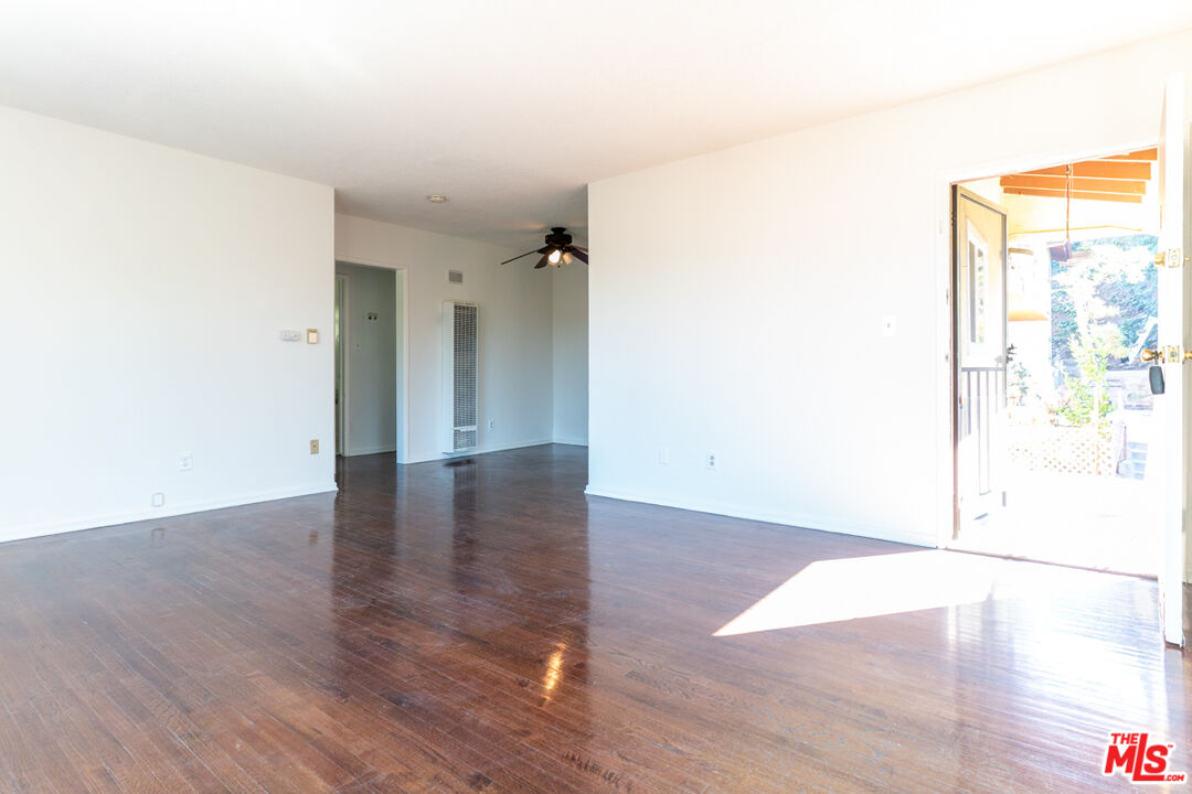 826 Hyperion Avenue Los Angeles, CA 90029 - Photo 13 of 25 a view of a hallway with wooden floor