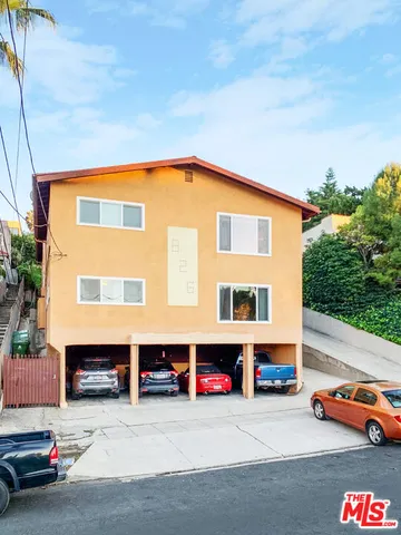 a front view of a house with parking