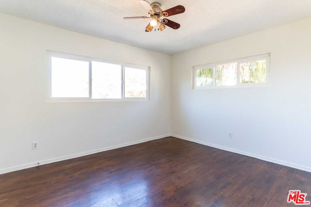 826 Hyperion Avenue Los Angeles, CA 90029 - Photo 21 of 25 wooden floor in an empty room with a window