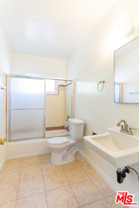 826 Hyperion Avenue Los Angeles, CA 90029 - Photo 22 of 25 a bathroom with a sink a toilet and shower