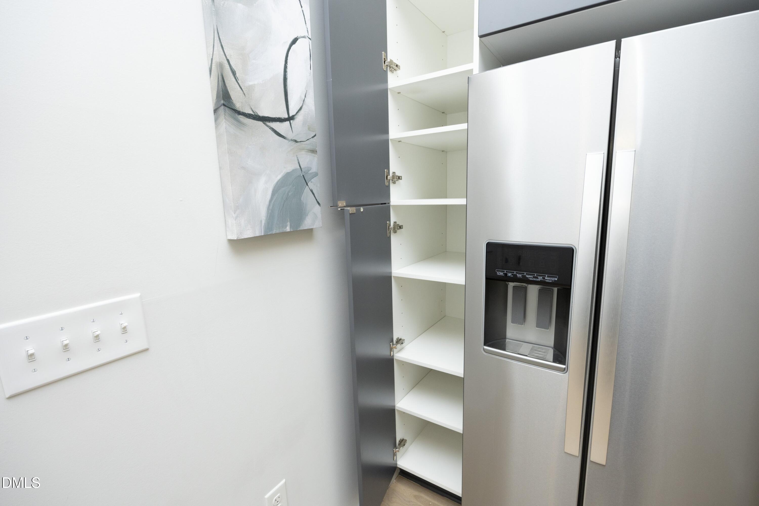 600 South Duke Street, Unit 26 Durham, NC 27701 - Photo 9 of 35 a room with cabinets and wooden floor