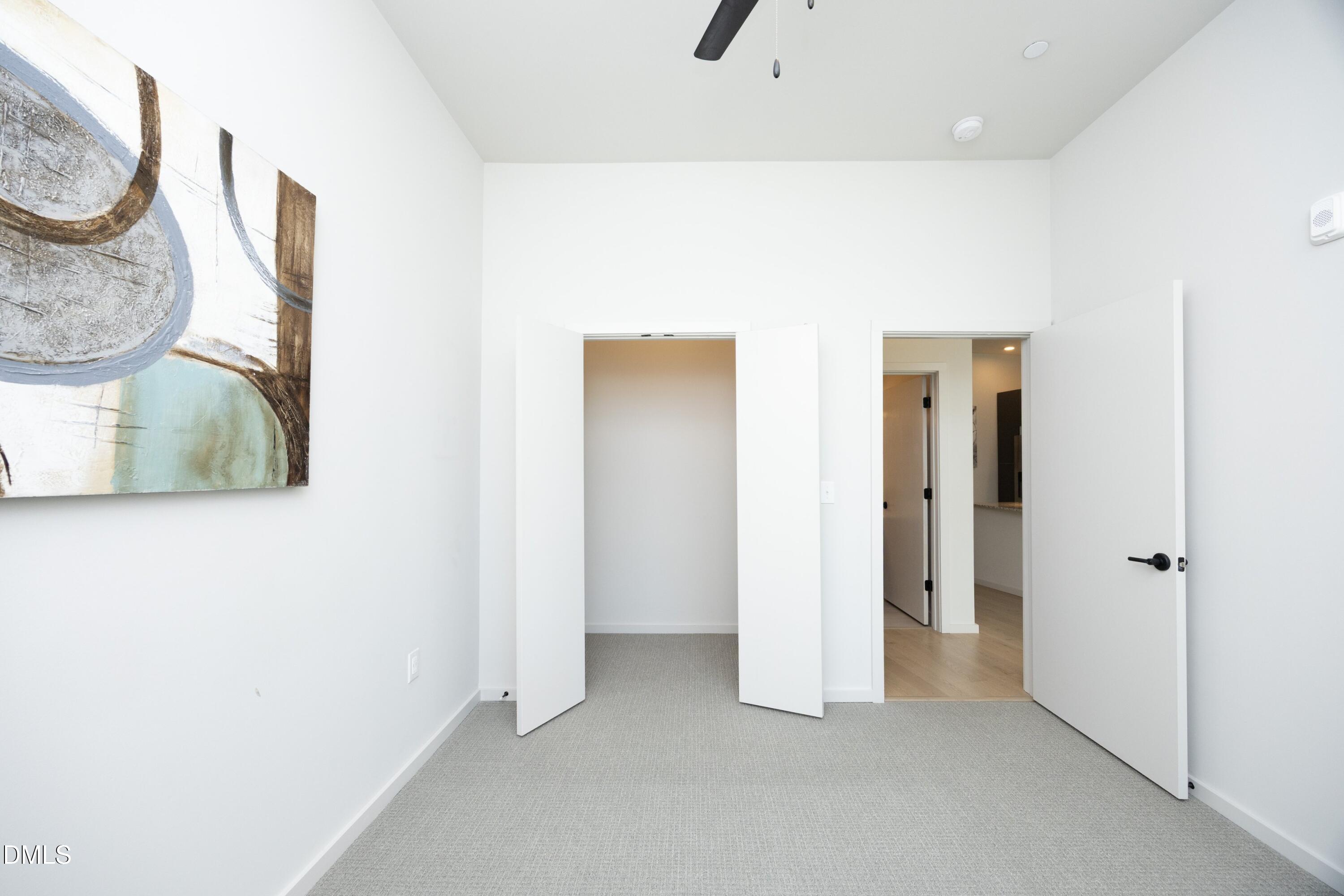 600 South Duke Street, Unit 26 Durham, NC 27701 - Photo 16 of 35 a view of a livingroom with wooden floor and a potted plant