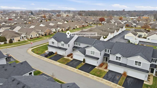 an aerial view of residential houses with outdoor space