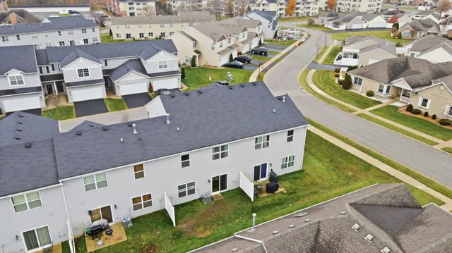an aerial view of a house with a swimming pool