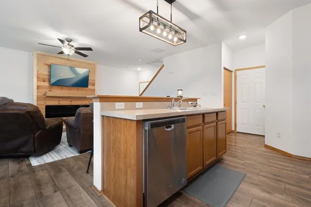 a kitchen with a sink appliances and cabinets
