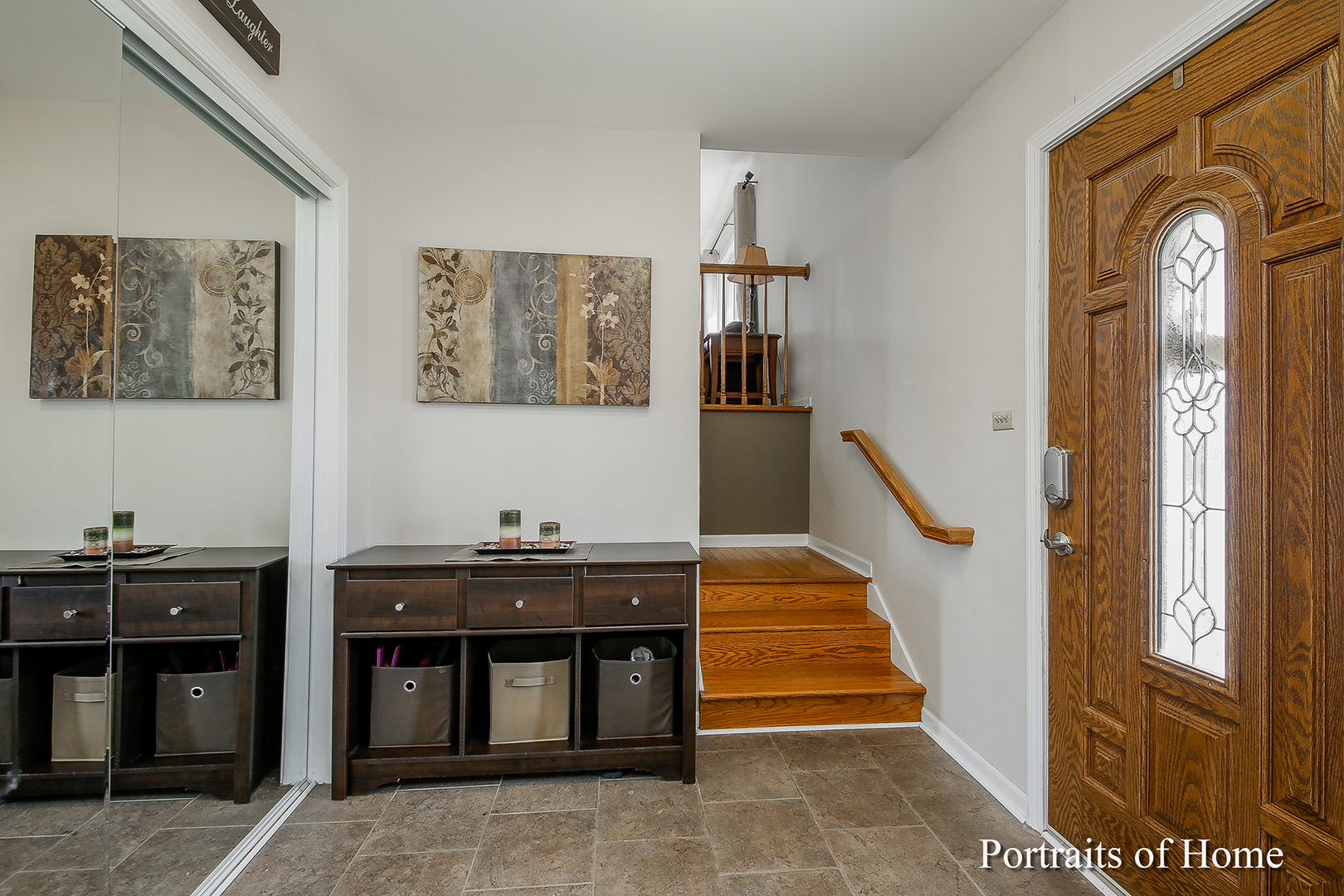 29W150 Smith Road West Chicago, IL 60185 - Photo 2 of 25 a view of a hallway with entryway dining room and hall with wooden floor