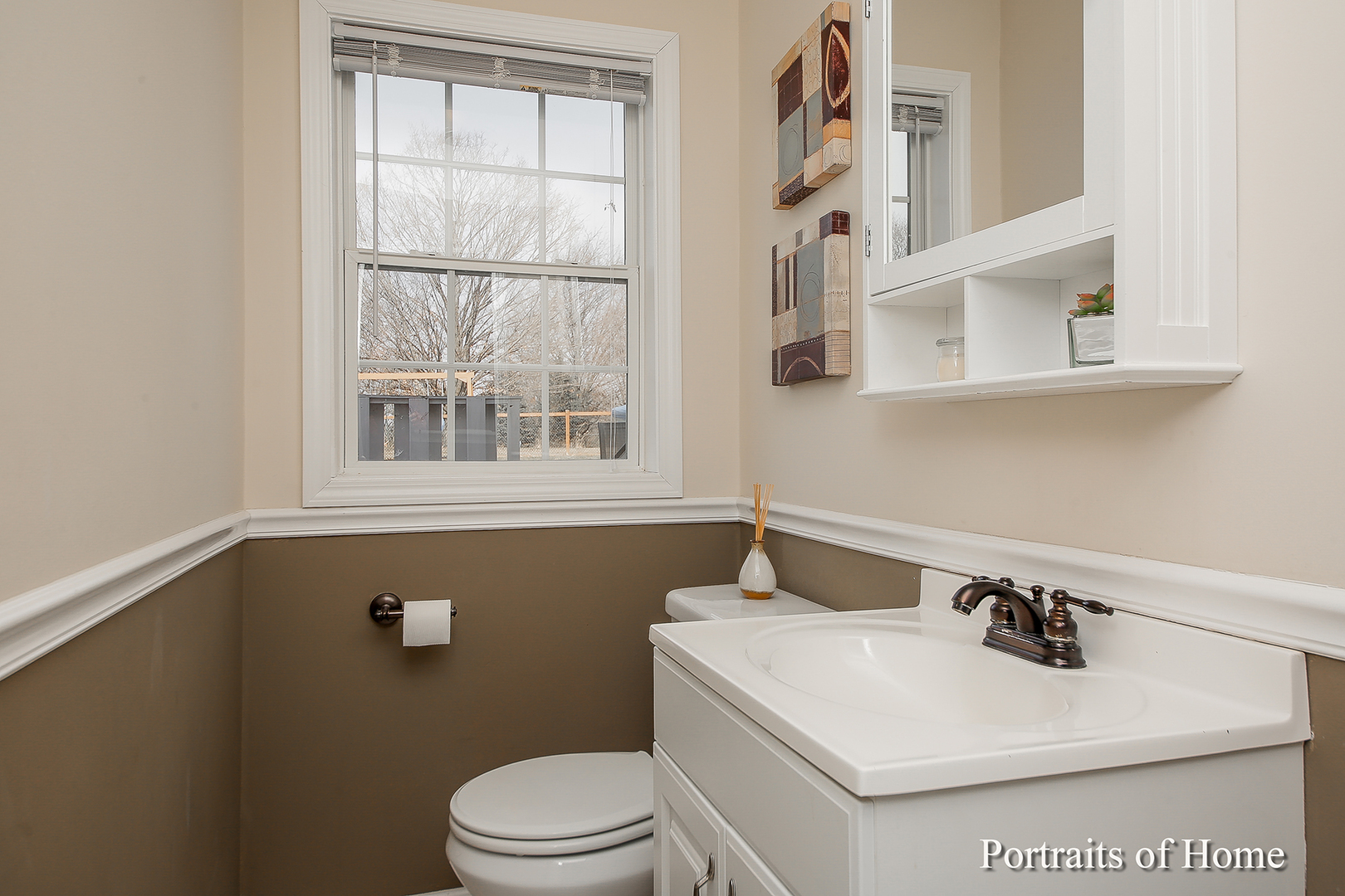 29W150 Smith Road West Chicago, IL 60185 - Photo 13 of 25 a bathroom with a sink a toilet and a window