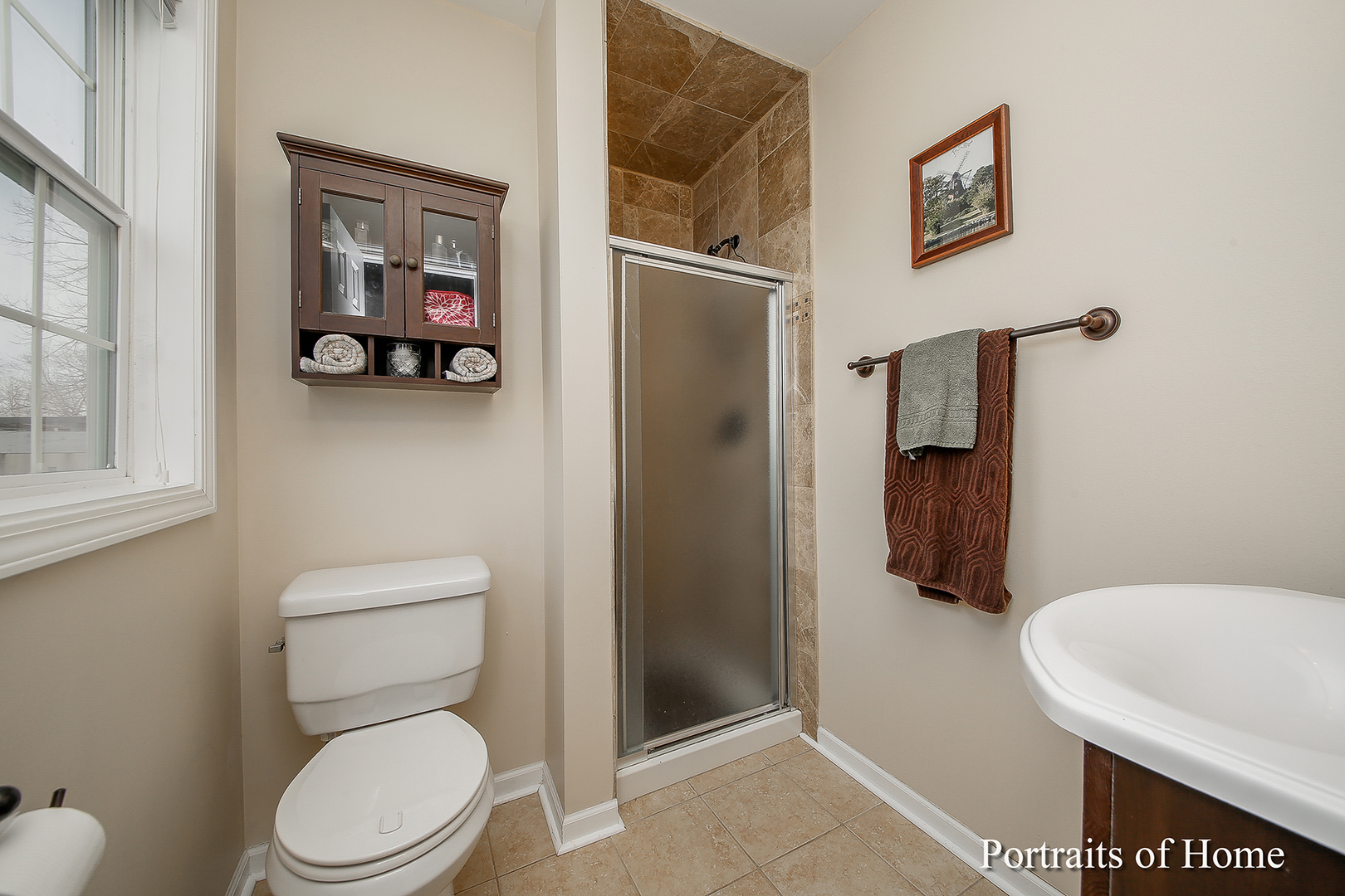 29W150 Smith Road West Chicago, IL 60185 - Photo 15 of 25 a white toilet sitting next to a bathroom sink