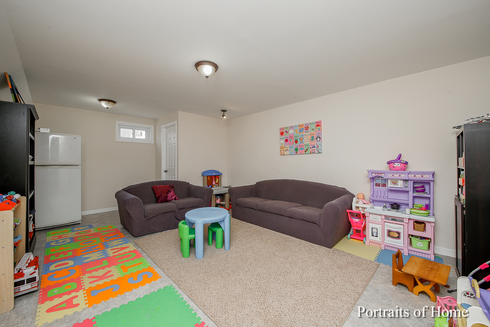 29W150 Smith Road West Chicago, IL 60185 - Photo 20 of 25 a living room with furniture and a baby crib