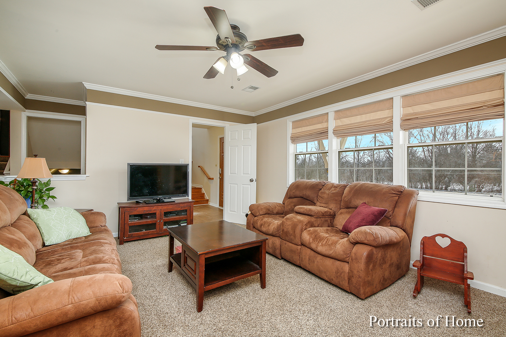 29W150 Smith Road West Chicago, IL 60185 - Photo 3 of 25 a living room with furniture and a flat screen tv