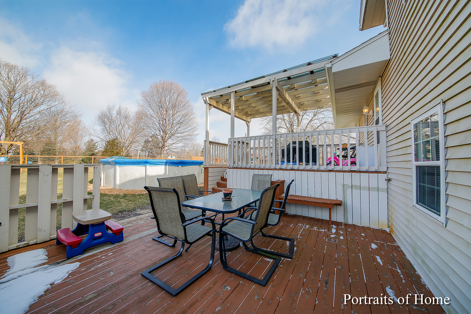 29W150 Smith Road West Chicago, IL 60185 - Photo 22 of 25 a view of deck with table and chairs and wooden floor