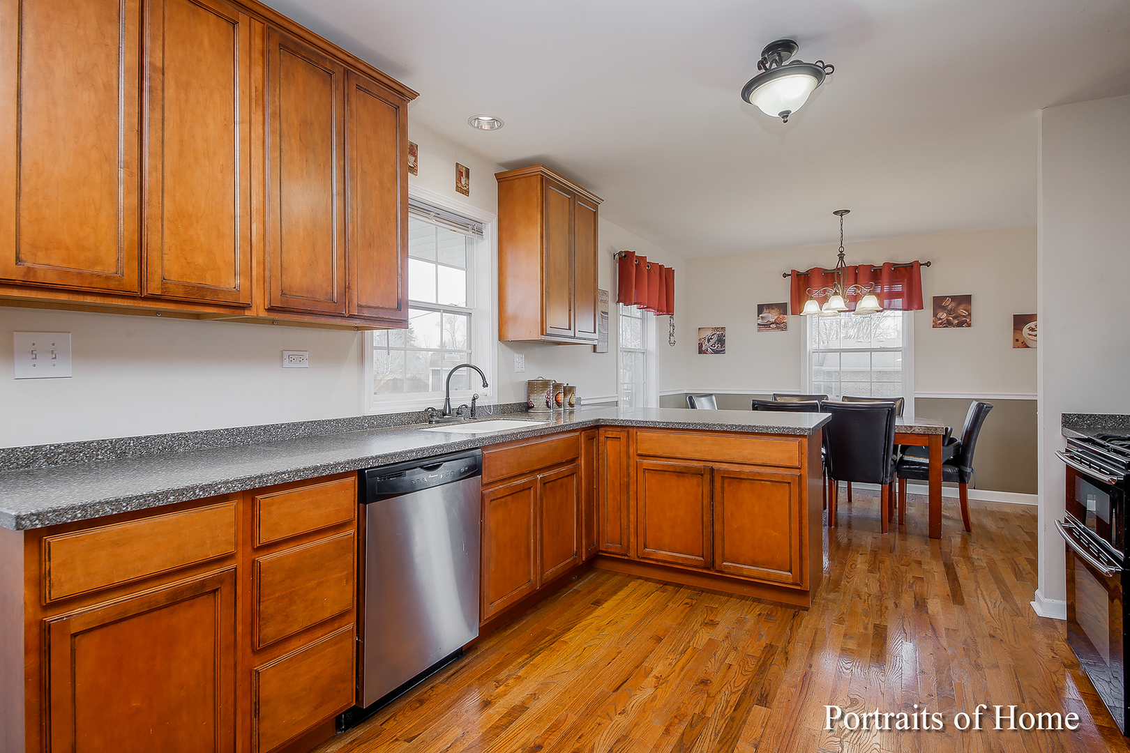 29W150 Smith Road West Chicago, IL 60185 - Photo 9 of 25 a kitchen with stainless steel appliances granite countertop wooden cabinets a sink and dishwasher