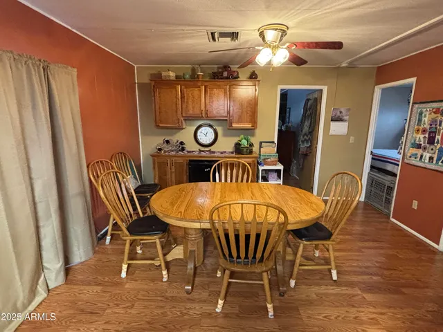 a dining room with furniture and window