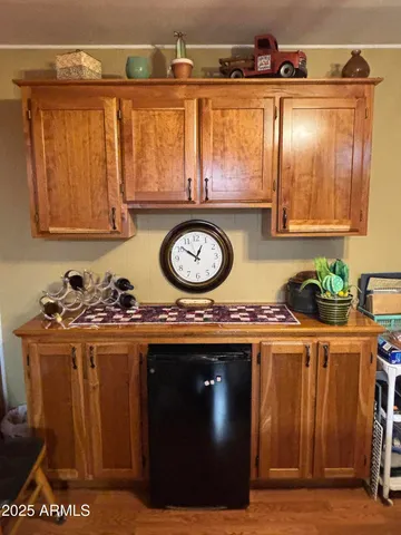 a kitchen with a stove and a refrigerator