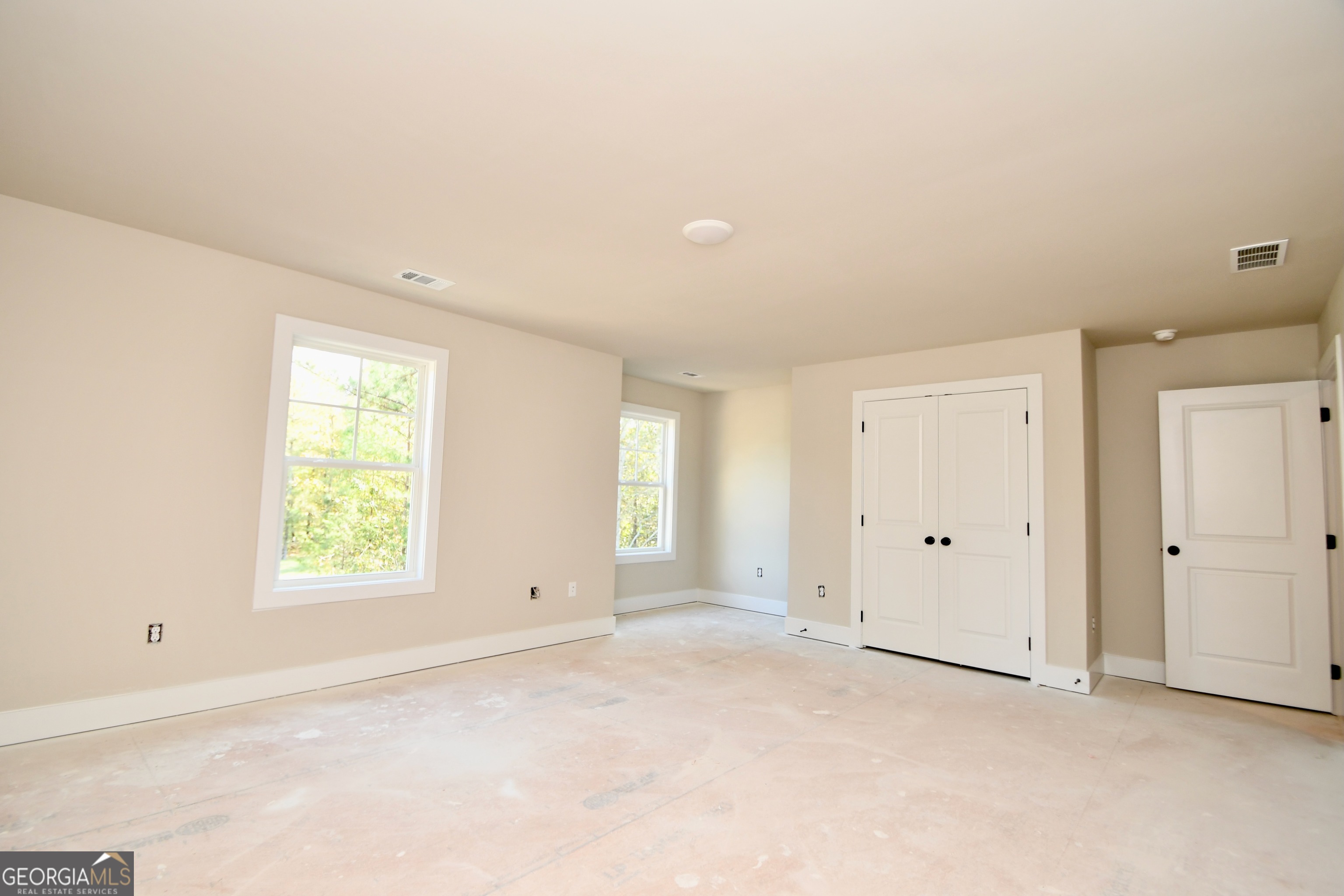 1021 Pointe Street South Tignall, GA 30668 - Photo 17 of 24 an empty room with windows