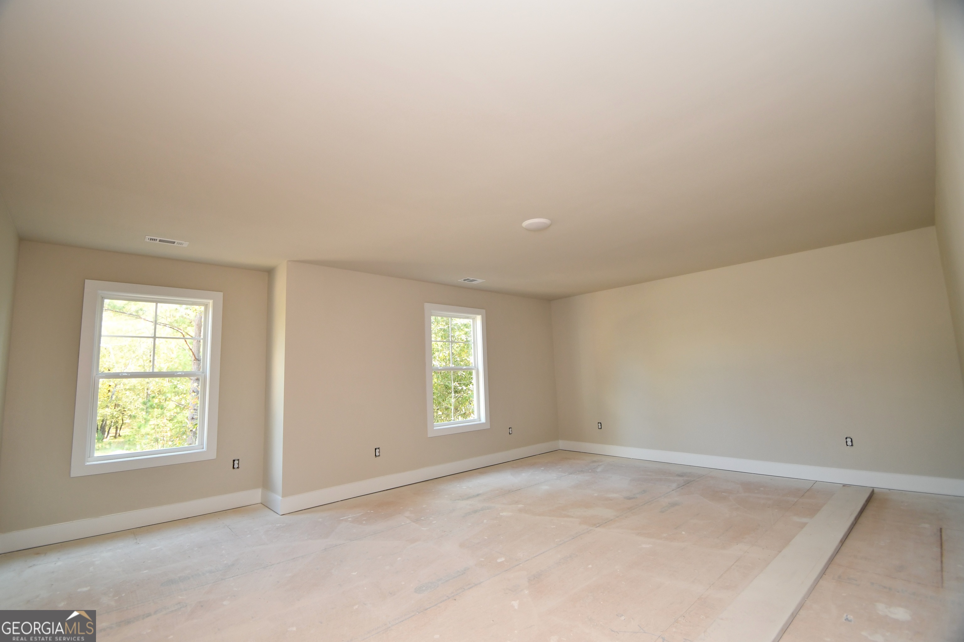 1021 Pointe Street South Tignall, GA 30668 - Photo 18 of 24 an empty room with windows
