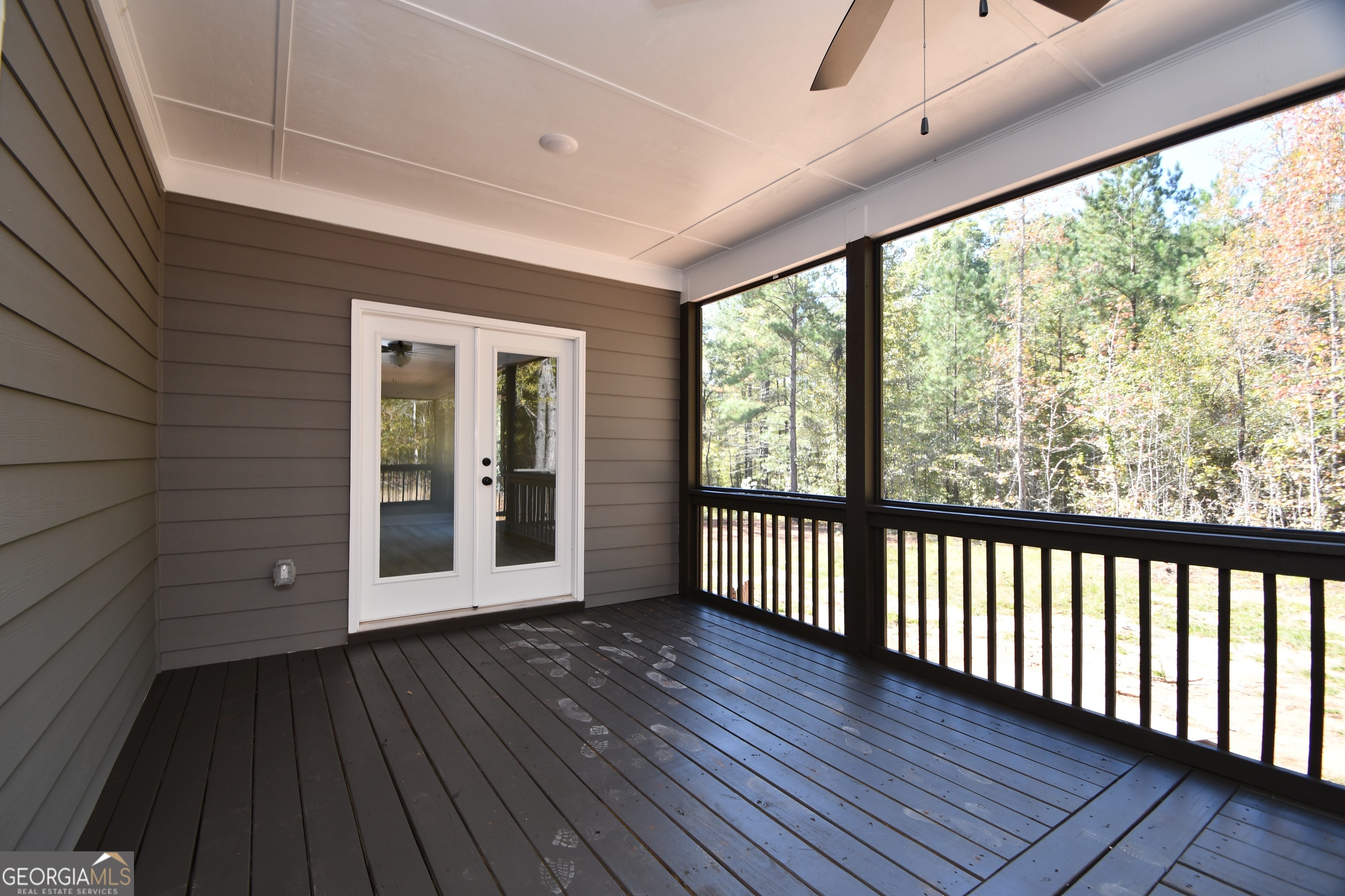 1021 Pointe Street South Tignall, GA 30668 - Photo 24 of 24 a view of a room with wooden floor and large window