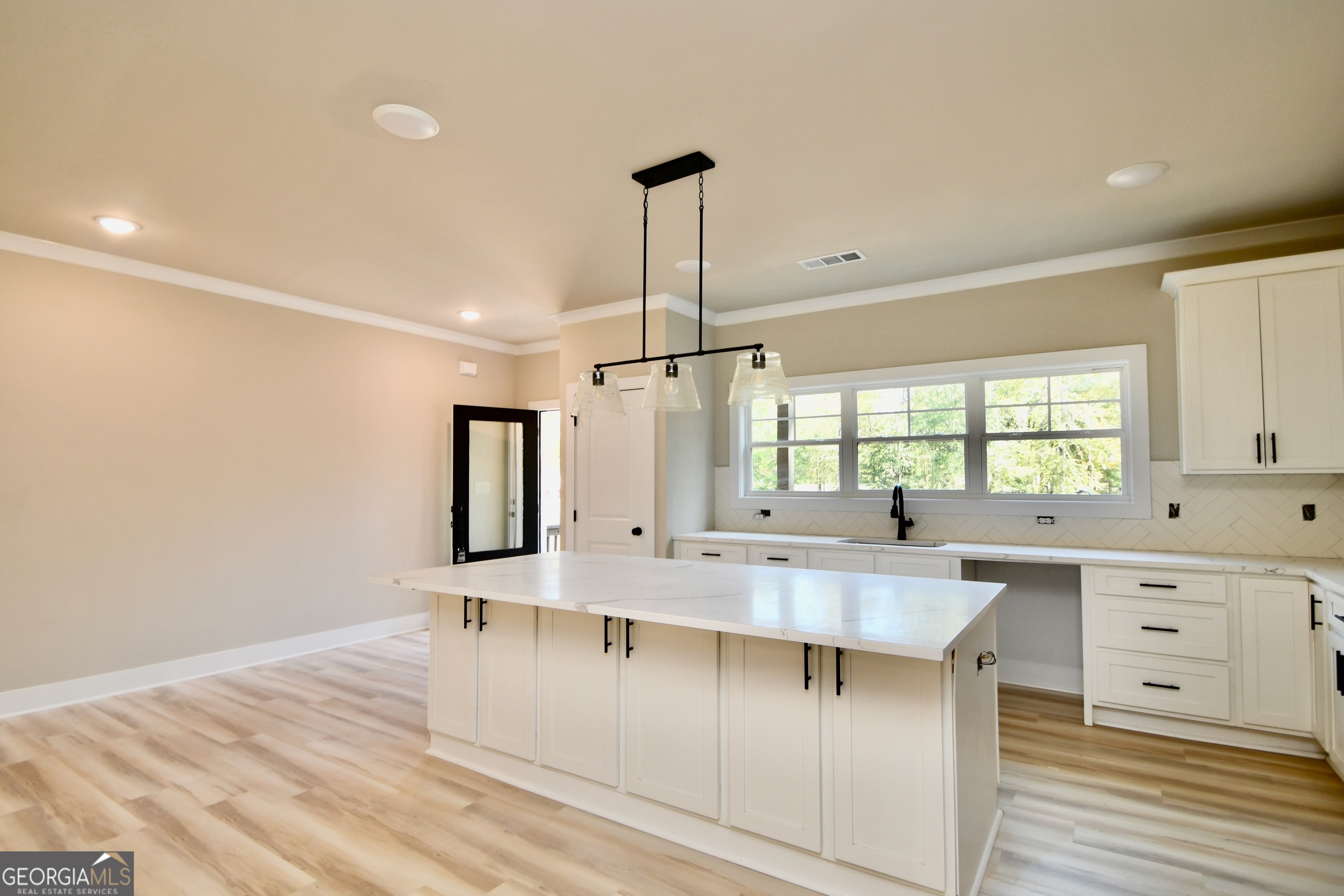 1021 Pointe Street South Tignall, GA 30668 - Photo 8 of 24 a large kitchen with lots of counter space and window