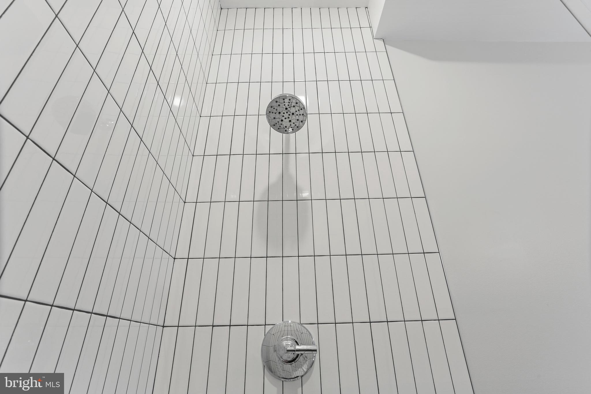 2248 Ontario Road Northwest, Unit PH8 Washington, DC 20009 - Photo 18 of 48 2"x8" White Subway Stacked Vertical Wall Tile