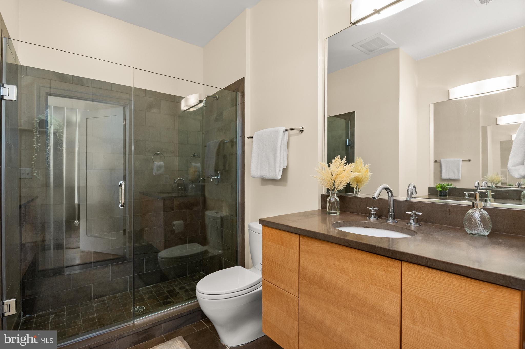 2516 Q Street Northwest, Unit C301 Washington, DC 20007 - Photo 8 of 17 Primary bathroom w/ dual vanities