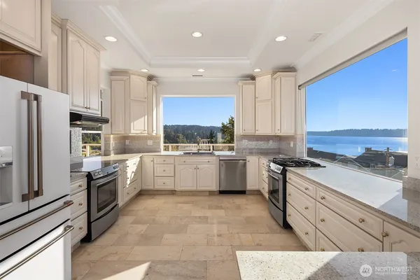 a kitchen with a sink stove and cabinets