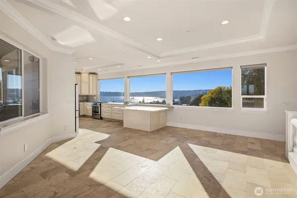 a kitchen with granite countertop a sink and a stove