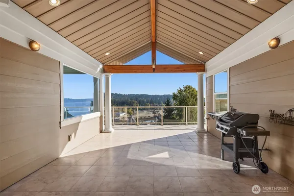 a view of a patio with a table and chairs